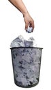 Abstract environmental protection hand throwing office used paper scraps into black metal trash isolated white background