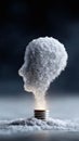 Abstract, evocative conceptual image of a lightbulb powering a human head shape formed from cloudlike material. Symbolizes ideas, Royalty Free Stock Photo