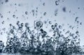 Abstract falling drops of water on a light background close-up Royalty Free Stock Photo