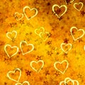 Abstract falling hearts and stars on gradient orange yellow background Royalty Free Stock Photo