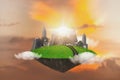 Abstract fantasy green island with cityscape floating in air with sunset sky background,Eco green energy and environment,save eart Royalty Free Stock Photo