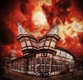 Abstract fantasy haunted house with dramatic sky.