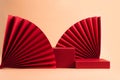 Abstract fashion podium for advertising cosmetics products. Red podium paper oriental fan pink pastel background