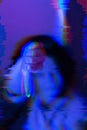 Abstract female portrait in blue neon light with glitch art effects and noise