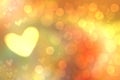 Abstract festive blur bright yellow orange pastel background with yellow hearts love bokeh for Mothers day, valentine or wedding