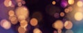 Abstract festive blurred background. Vibrant bokeh lights. Bright defocused glowing lights effect.