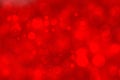 Abstract festive blurred red background texture with bokeh circles and lights for Valentine or wedding day. Card concept. Space Royalty Free Stock Photo