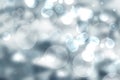 Abstract festive gradient blue gray silver bokeh background texture with white bokeh lights. Beautiful backdrop with space for Royalty Free Stock Photo