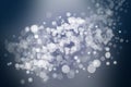 Abstract festive gradient dark blue gray silver bokeh background texture with white bokeh lights. Beautiful backdrop with space Royalty Free Stock Photo