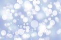 Abstract festive gradient light blue gray silver bokeh background texture with white bokeh lights. Beautiful backdrop with space Royalty Free Stock Photo