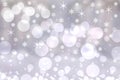 Abstract festive gradient light gray silver bokeh background texture with white bokeh lights and stars. Beautiful backdrop with Royalty Free Stock Photo