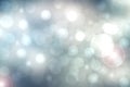 Abstract festive light blue silver bokeh background texture with colorful circles and bokeh lights. Beautiful backdrop with space Royalty Free Stock Photo