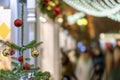 Abstract festive lights and Christmas shopping, crowd of people. Christmas tree with decorations, blurred background Royalty Free Stock Photo