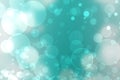 Abstract festive turquoise silver shining glitter background texture with blurred bokeh circles and white lights. Space for design Royalty Free Stock Photo