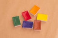 Fugural still life photo image of bright waterpaint bloks on craft paper