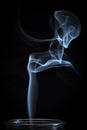 An Abstract Fine Blue Smoke Flowing From Vertical Bottle Background