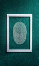Abstract fingerprint art in a white frame against a teal background Royalty Free Stock Photo