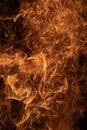 Abstract fire background. Flames overlay. Hot inferno background. Dramatic fire texture. Burning fire pattern. Glowing flames Royalty Free Stock Photo
