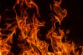 Abstract flame, fire flame texture, background. Tongues of fire on a dark background. Royalty Free Stock Photo