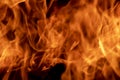Abstract flame, fire flame texture, background. Tongues of fire on a dark background. Royalty Free Stock Photo