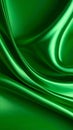 Abstract flowing shiny green silk fabric with a smooth texture in a seamless pattern Royalty Free Stock Photo