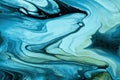 Abstract fluid art background black and blue colors. Liquid marble. Acrylic painting on canvas with turquoise gradient Royalty Free Stock Photo