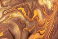 Abstract fluid art background dark brown and golden colors. Liquid marble. Acrylic painting with bronze gradient Royalty Free Stock Photo