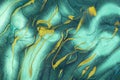 Abstract fluid art background light blue and golden colors. Liquid marble. Acrylic painting with cerulean gradient Royalty Free Stock Photo