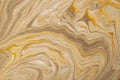 Abstract fluid art background light brown and golden colors. Liquid marble. Acrylic painting with beige gradient Royalty Free Stock Photo