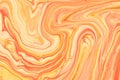 Abstract fluid art background light orange and golden colors. Liquid marble. Acrylic painting with coral gradient Royalty Free Stock Photo