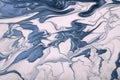 Abstract fluid art background navy blue and white colors. Liquid marble. Acrylic painting with swirl denim gradient