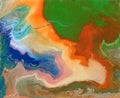 Abstract fluid art painting in acrylic paint, mixture of blue, orange, yellow, white and green paints. Imitation of marble or Royalty Free Stock Photo