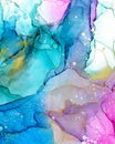 Abstract fluid art painting. Transparent overlayers of alcohol inks of purple and blue and yellow ombre colors. Royalty Free Stock Photo