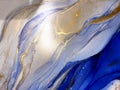 Abstract fluid blue background with gold. Liquid abstraction. Alcohol ink art resembles sea, watercolor or aquarelle.