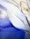 Abstract fluid blue background with gold. Liquid abstraction. Alcohol ink art resembles sea, watercolor or aquarelle.