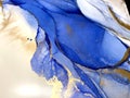 Abstract fluid blue background with gold. Liquid abstraction. Alcohol ink art resembles sea, watercolor or aquarelle.