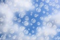 Abstract Flying Bubbles in Blurred Blue Sky Background Royalty Free Stock Photo