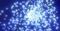 Abstract flying small round blue glowing particles of bokeh and glare with shiny energetic magical glowing rays on a dark Royalty Free Stock Photo