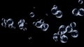 Abstract flying transparent blue bubbles on black background. Shallow depth of field. Soap bubbles flying on black Royalty Free Stock Photo