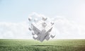 Abstract flying white cubes on green meadow