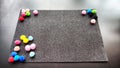 Abstract frame with a black velvet rectangle and multicolored balls. Background and texture with black color and colored Royalty Free Stock Photo