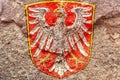 Faded Coat of arms of Frankfurt isolated on weathered solid rock wall background