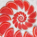 Abstract fruit jelly wedges red cantle lobule on white sugar background. Red jellies. Abstract fruit jelly on white sugar backgrou