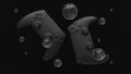 Abstract game controllers, transparent soap bubbles with reflections. Black controllers with matte reflections. Gamepads for games