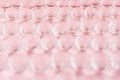 Abstract gentle pink background - transparent glass balls on pastel backdrop, blur.