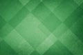 Abstract geometric background in green with texture, layers of triangle and diamond shapes in modern art style background Royalty Free Stock Photo