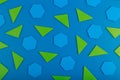 Abstract geometric background with green triangles and blue polygons on blue background
