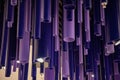 Abstract geometric background. Purple and blue cylinder pipes of different lengths and diameters. Unusual decorations