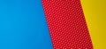 Abstract geometric blue, yellow and red polka dot paper background. Royalty Free Stock Photo