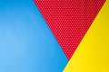 Abstract geometric blue, yellow and red polka dot paper background. Royalty Free Stock Photo